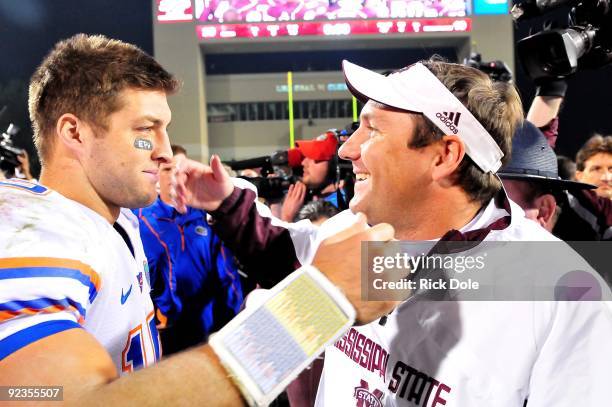 Quarterback Tim Tebow of the Florida Gators and Mississippi State Bulldogs head coach Dan Mullen greet one another following the game, at Davis Wade...