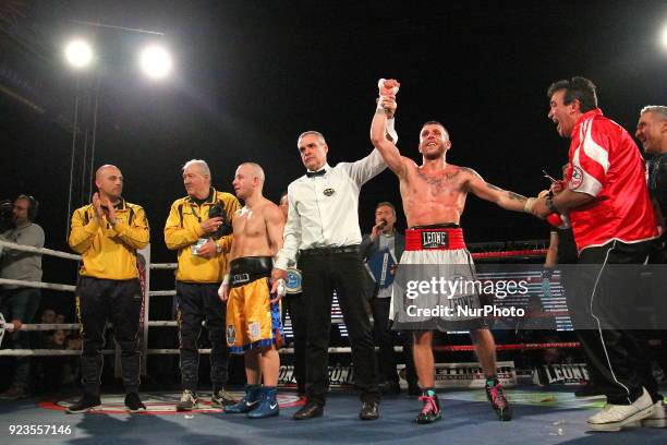 Francesco Grandelli raises his hand in the air to the crowd after the italian featherweight title boxing match bout against Emiliano Salvini on 23...