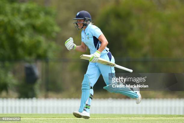 Allyssa Healy of NSW celebrates scoring a century during the WNCL Final match between New South Wales and Western Australia at Blacktown...