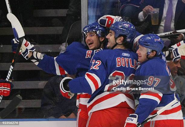 Artem Anisimov, Brian Boyle and Matt Gilroy of the New York Rangers celebrate Anisimov's first period goal against of the Phoenix Coyotes on October...