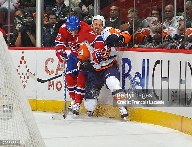 Mike Cammalleri of the Montreal Canadiens checks Radek Martinek of the New York Islanders during the NHL game on October 26, 2009 at the Bell Center...