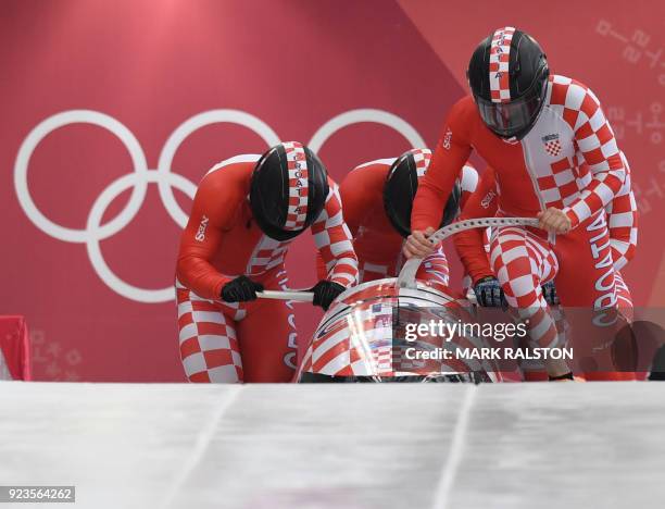 Croatia's Drazen Silic leads his team in the 4-man bobsleigh heat 1 run during the Pyeongchang 2018 Winter Olympic Games, at the Olympic Sliding...