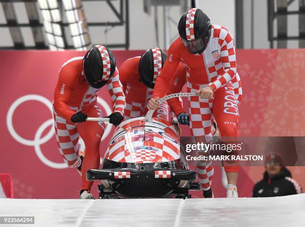 Croatia's Drazen Silic leads his team in the 4-man bobsleigh heat 1 run during the Pyeongchang 2018 Winter Olympic Games, at the Olympic Sliding...