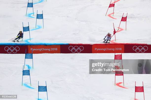 Charlie Guest of Great Britain and Megan McJames of the United States compete during the Alpine Team Event 1/8 Finals on day 15 of the PyeongChang...