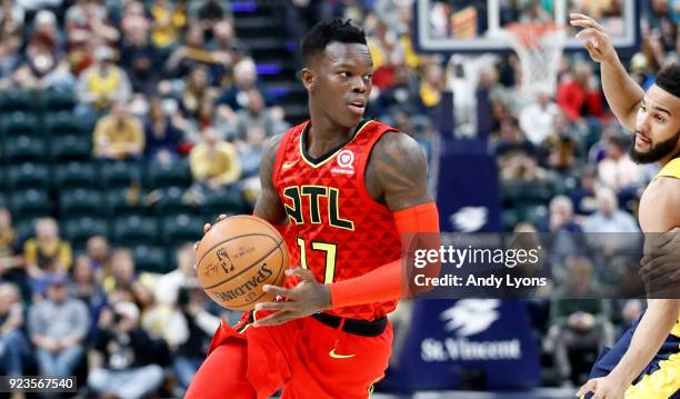 Dennis Schroder of the Atlanta Hawks dribbles the ball against the Indiana Pacers during the game at Bankers Life Fieldhouse on February 23, 2018 in...