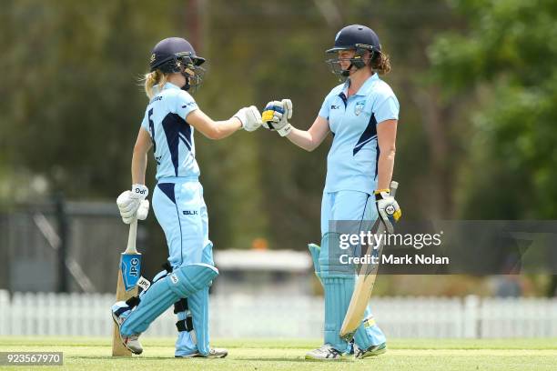 Nicola Carey and Rene Farrell of NSW meet mid wicket during the WNCL Final match between New South Wales and Western Australia at Blacktown...