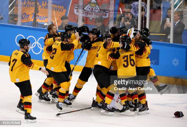 Players of Germany celebrate after victory in Men's Semifinal ice hockey match between Canada and Germany on day fourteen of the 2018 Winter Olympic...