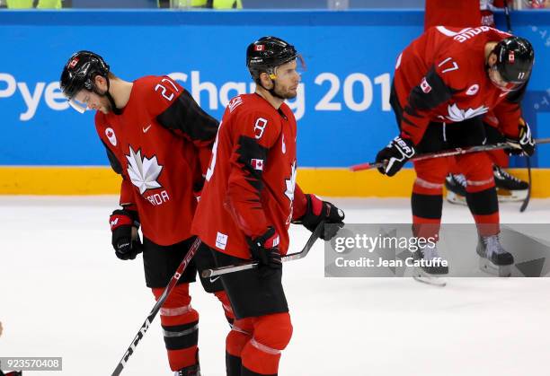 Cody Goloubef and Wojtek Wolski of Canada look dejected after defeat in Men's Semifinal ice hockey match between Canada and Germany on day fourteen...