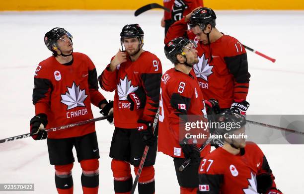 Christian Thomas, Linden Vey, Wojtek Wolski and Rene Bourque of Canada look dejected after defeat in Men's Semifinal ice hockey match between Canada...