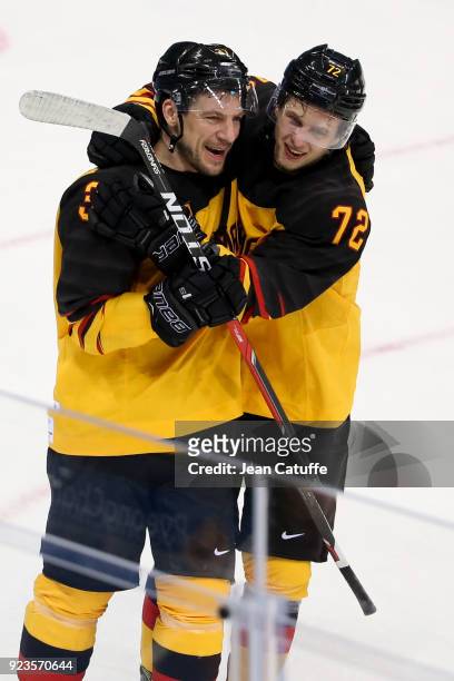 Patrick Reimer and Dominik Kahun of Germany celebrate after victory in Men's Semifinal ice hockey match between Canada and Germany on day fourteen of...