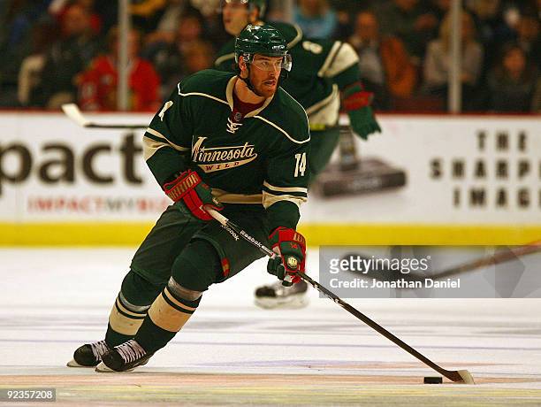 Martin Havlat of the Minnesota Wild looks to pass the puck against the Chicago Blackhawks at the United Center on October 26, 2009 in Chicago,...