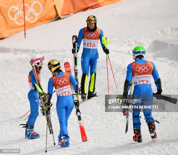 Italy's Irene Curtoni, Alex Vinatzer, Chiara Costazza and Riccardo Tonetti react after competing in the Alpine Skiing Team Event quarter-finals at...