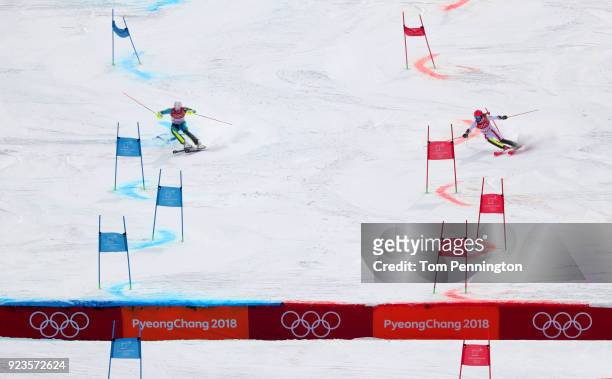 Manuel Feller of Austria and Andre Mhyrer of Sweden compete during the Alpine Team Event Quarterfinals on day 15 of the PyeongChang 2018 Winter...