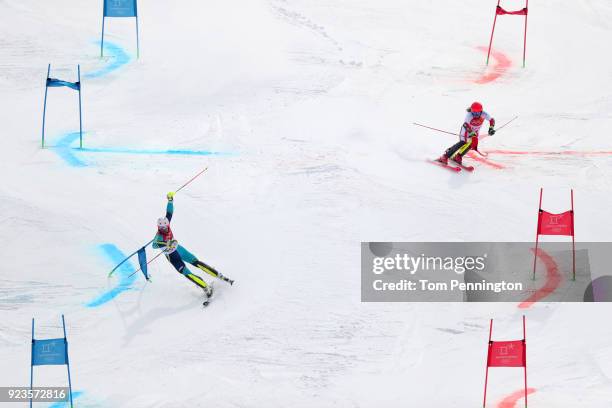 Manuel Feller of Austria and Andre Mhyrer of Sweden compete during the Alpine Team Event Quarterfinals on day 15 of the PyeongChang 2018 Winter...