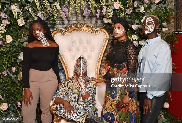 Artist Laolu Senbanjo poses with models painted with his work as Instagram celebrates #BlackGirlMagic and #BlackCreatives on February 23, 2018 in New...