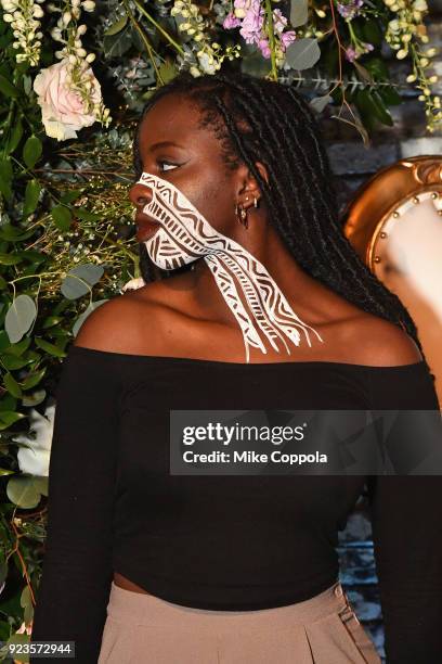 Model painted by artist Laolu Senbanjo poses as Instagram celebrates #BlackGirlMagic and #BlackCreatives on February 23, 2018 in New York City.