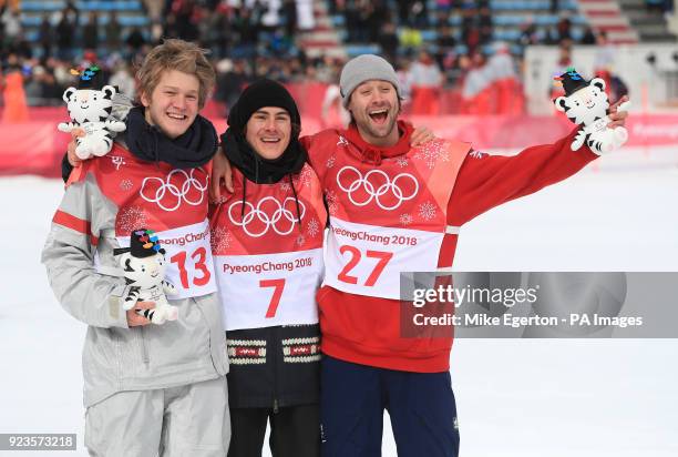 Great Britain's Billy Morgan celebrates a bronze medal along side Kyle Mack and Sebastien Toutant in the Men's Snowboarding Big Air Final at the...