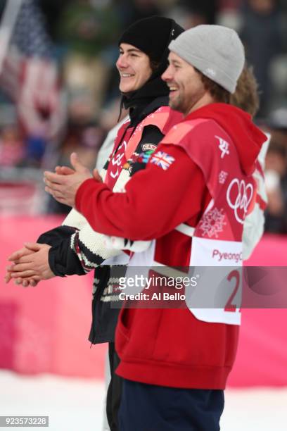 Gold medalist Sebastien Toutant of Canada and bronze medalist Billy Morgan of Great Britain celebrate during the victory ceremony after the Men's Big...