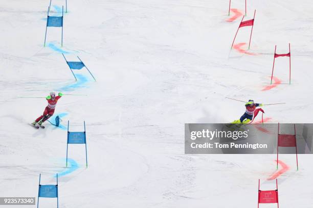 Sebastian Foss-Solevaag of Norway and Dave Ryding of Great Britain compete during the Alpine Team Event Quarterfinals on day 15 of the PyeongChang...