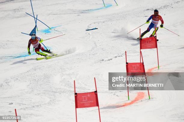 France's Alexis Pinturault and Switzerland's Daniel Yule compete in the Alpine Skiing Team Event semi-finals at the Jeongseon Alpine Center during...