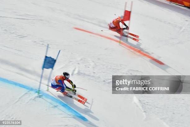 France's Tessa Worley and Norway's Kristin Lysdahl compete in the Alpine Skiing Team Event small final at the Jeongseon Alpine Center during the...