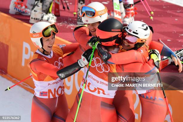 Norway's Kristin Lysdahl, Norway's Sebastian Foss-Solevaag, Norway's Nina Haver-Loeseth and Norway's Leif Kristian Nestvold-Haugen celebrate after...