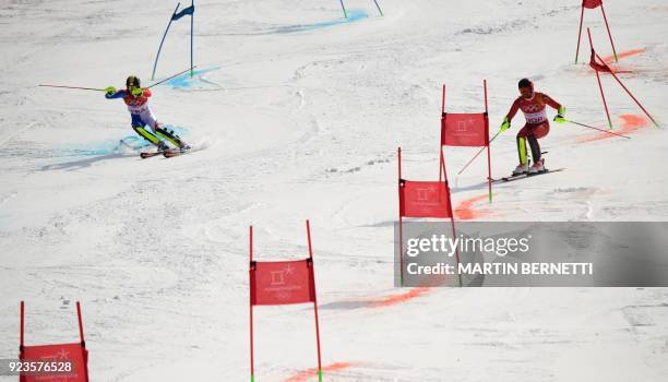 France's Clement Noel and Norway's Leif Kristian Nestvold-Haugen compete in the Alpine Skiing Team Event small final at the Jeongseon Alpine Center...