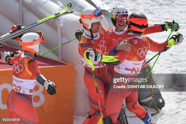 Norway's Kristin Lysdahl, Norway's Sebastian Foss-Solevaag, Norway's Nina Haver-Loeseth and Norway's Leif Kristian Nestvold-Haugen celebrate after...