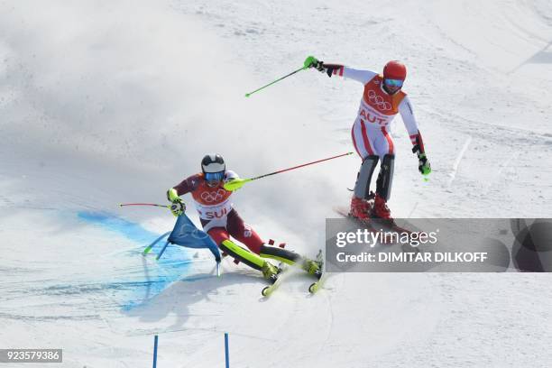 Switzerland's Daniel Yule and Austria's Marco Schwarz compete in the Alpine Skiing Team Event big final at the Jeongseon Alpine Center during the...