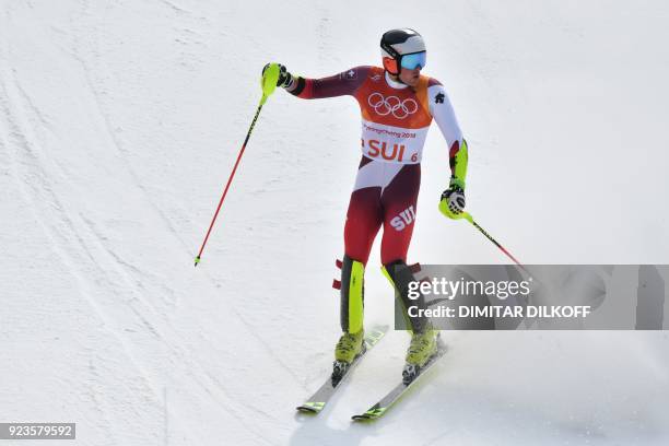 Switzerland's Daniel Yule reacts as he crosses the finish-line in the Alpine Skiing Team Event big final at the Jeongseon Alpine Center during the...