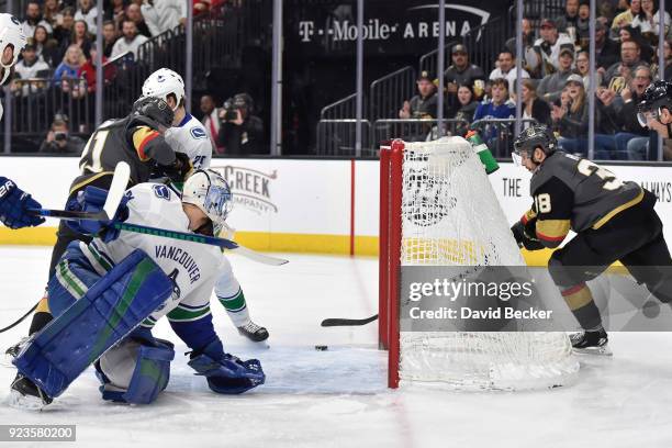 Tomas Hyka scores his first career NHL goal as his teammate Cody Eakin of the Vegas Golden Knights battles in front of goalie Anders Nilsson and...