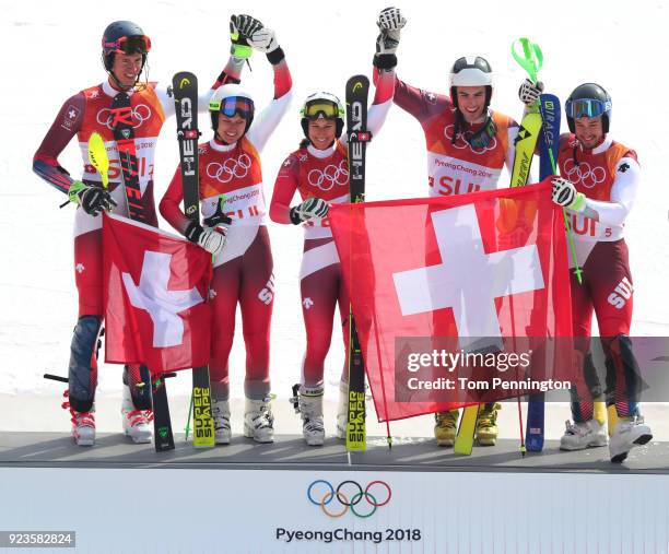 Gold medallists Switzerland with Ramon Zenhaeusern, Daniel Yule, Luca Aerni, Wendy Holdener and Denise Feierabend celebrate during the victory...