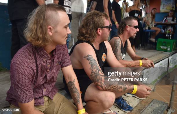 Men wait to be judged on their mullet hairstyles at Mulletfest 2018 in the town of Kurri Kurri, 150 kms north of Sydney on February 24, 2018....