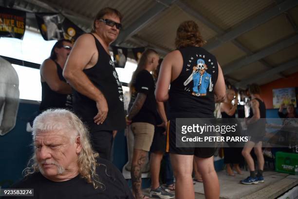 Men wait to be judged on their mullet hairstyles at Mulletfest 2018 in the town of Kurri Kurri, 150 kms north of Sydney on February 24, 2018....
