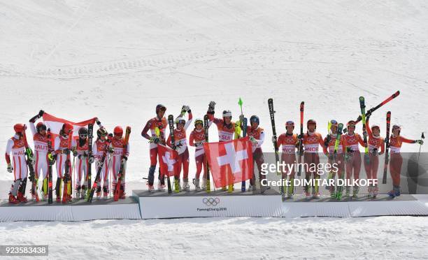 Austria's second place winners Marco Schwarz, Michael Matt, Manuel Feller, Katharina Liensberger, Katharina Gallhuber and Stephanie Brunner,...