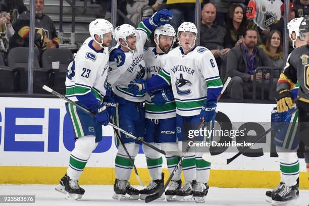 Sven Baertschi celebrates after scoring a goal with his teammates Alexander Edler, Sam Gagner and Brock Boeser of the Vancouver Canucks against the...