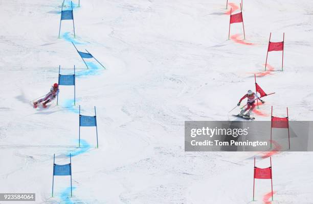 Katharina Gallhuber of Austria and Wendy Holdener of Switzerland compete during the Alpine Team Event Big Final on day 15 of the PyeongChang 2018...