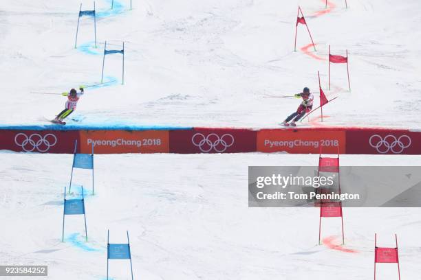 Michael Matt of Austria and Ramon Zenhaeusern of Switzerland compete during the Alpine Team Event Big Final on day 15 of the PyeongChang 2018 Winter...