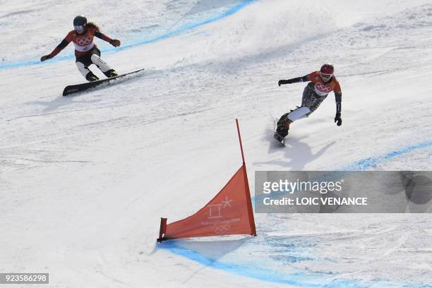 Switzerland's Patrizia Kummer and Czech Republic's Ester Ledecka compete during a 1/8 final heat of the women's snowboard parallel giant slalom event...
