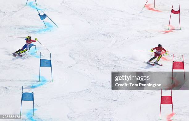 Clement Noel of France and Leif Kristian Nestvold-Haugen of Norway compete during the Alpine Team Event Small Final on day 15 of the PyeongChang 2018...