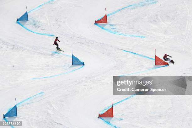 Ester Ledecka of the Czech Republic and Patrizia Kummer of Switzerland compete during the Ladies' Snowboard Parallel Giant Slalom 1/8 Final on day...