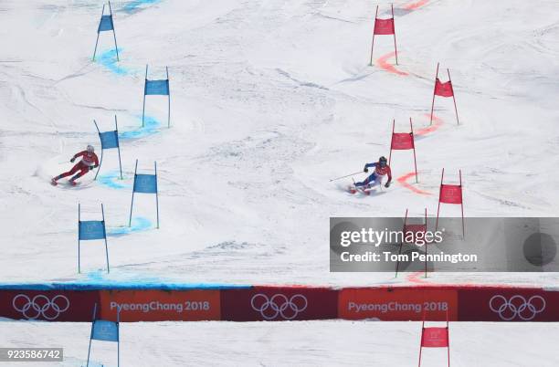 Nina Haver-Loeseth of Norway and Adeline Baud Mugnier of France compete during the Alpine Team Event Small Final on day 15 of the PyeongChang 2018...