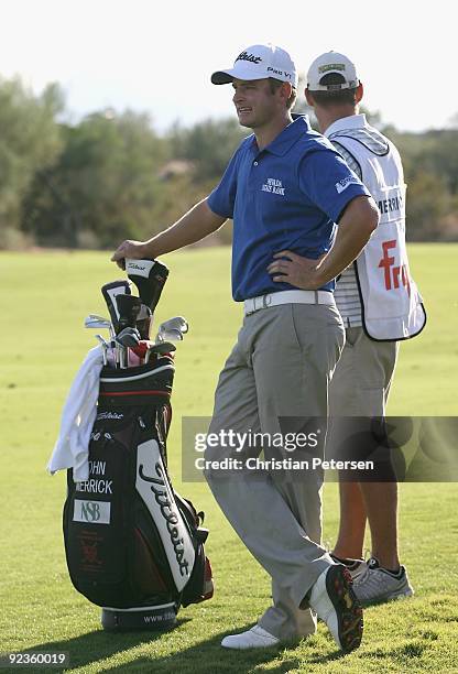 John Merrick stands with his caddie and bag during the second round of the Frys.com Open at Grayhawk Golf Club on October 23, 2009 in Scottsdale,...