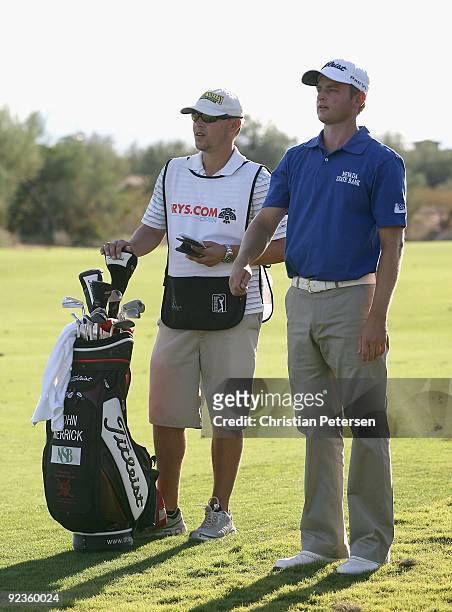 John Merrick stands with his caddie and bag during the second round of the Frys.com Open at Grayhawk Golf Club on October 23, 2009 in Scottsdale,...