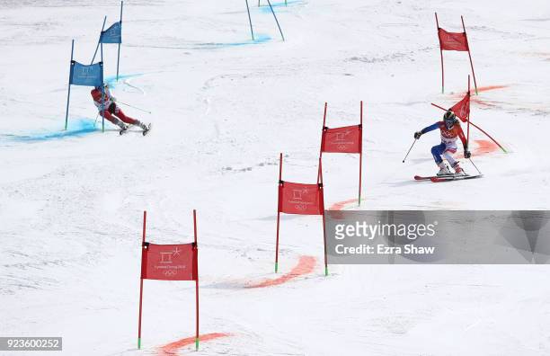 Denise Feierabend of Switzerland and Adeline Baud Mugnier of France compete during the Alpine Team Event Semifinals on day 15 of the PyeongChang 2018...