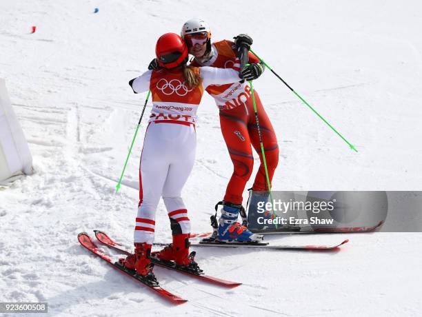 Nina Haver-Loeseth of Norway and Katharina Gallhuber of Austria hug during the Alpine Team Event Semifinals on day 15 of the PyeongChang 2018 Winter...