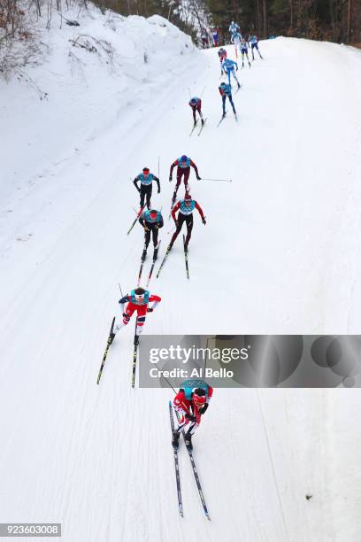 Alex Harvey of Canada, Emil Iversen of Norway, Andreas Katz of Germany and Dario Cologna of Switzerland compete during the Men's 50km Mass Start...