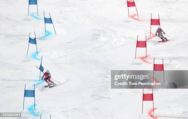 Wendy Holdener of Switzerland and Mariann Mimi Maroty of Hungary compete during the Alpine Team Event 1/8 Finals on day 15 of the PyeongChang 2018...