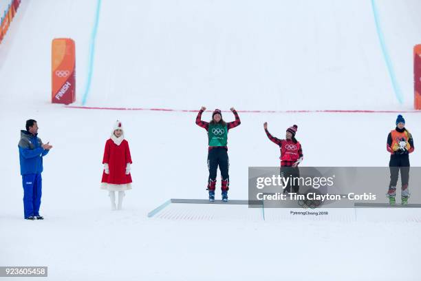 Silver medal winner Brittany Phelan of Canada celebrates watched by gold medal winner Kelsey Serwa of Canada and bronze medal winner Fanny Smith of...