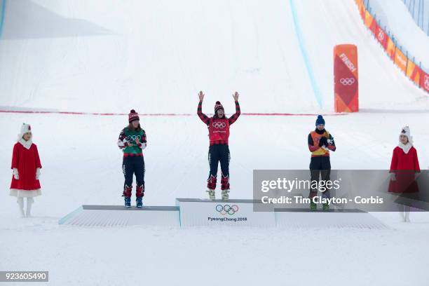 Gold medal winner Kelsey Serwa of Canada celebrates on the podium watched by silver medal winner Brittany Phelan of Canada and bronze medal winner...